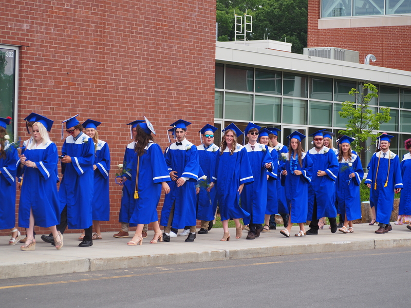 Graduates walking towards the field